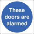 These doors are alarmed sign