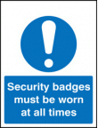 Security badges must be worn all times sign