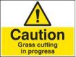 Caution grass cutting in progress sign