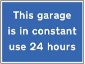 This garage is in constant use 24 hours sign