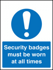 Security badges must be worn all times sign